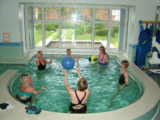 Photo of people throwing a ball in the pool