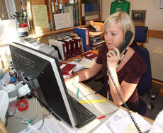 Photo of a receptionist on the phone